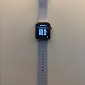 Apple Smartwatch with Gold Case and light blue Band